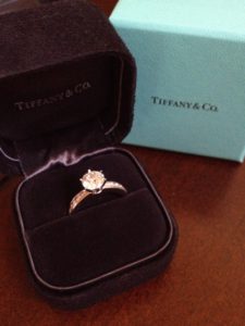 THE TIFFANY® SETTING ENGAGEMENT RING WITH DIAMOND BAND IN PLATINUM